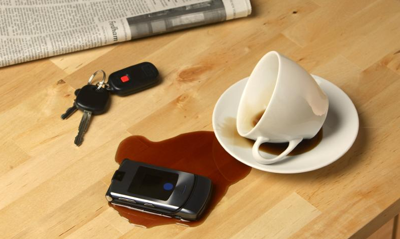 Phone covered in coffee
