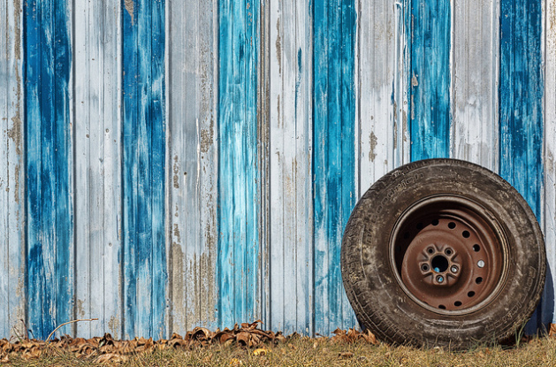 damaged tire against wall