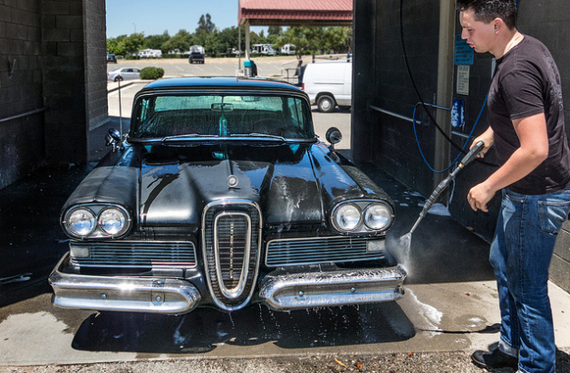 man washing car