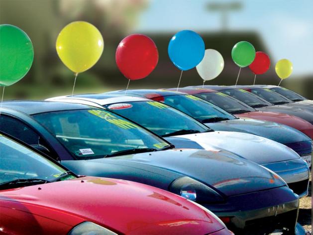 Line of cars for sale on a car lot