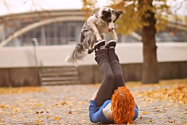 Woman doing tricks with her dog