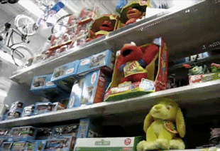 Elmo toy flying off a shelf