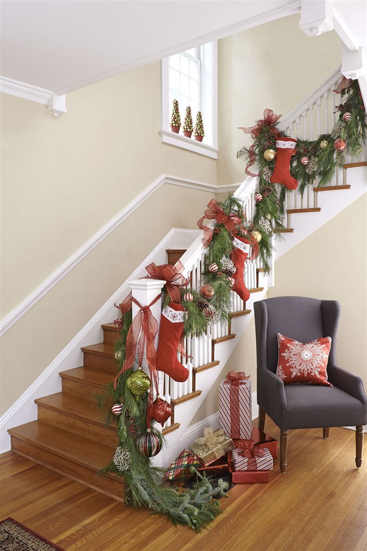 stair banister decorated for christmas