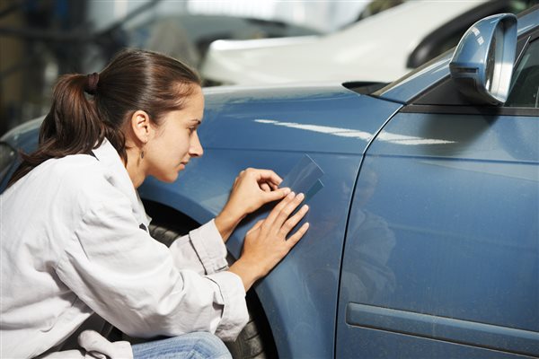 woman caring for a car