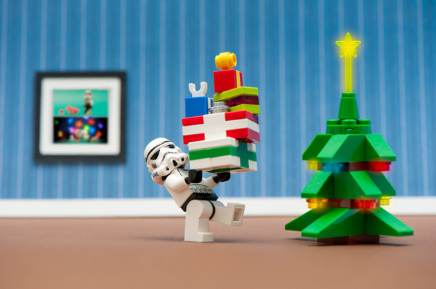 lego storm trooper carrying presents to the christmas tree