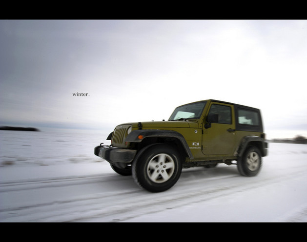 jeep driving on snowy road