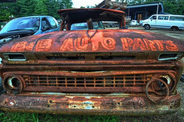 old rusted truck in salvage yard