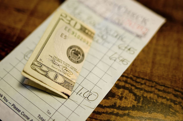 $20 bill on restaurant check
