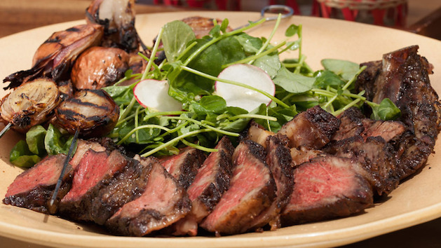 grilled ribeye steak sliced with watercrest salad