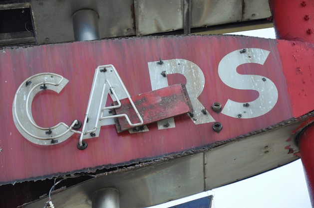 old sign that says Cars