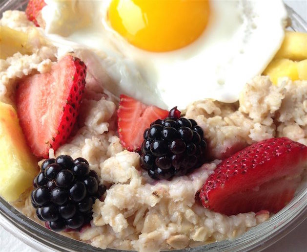 berries and egg over oatmeal