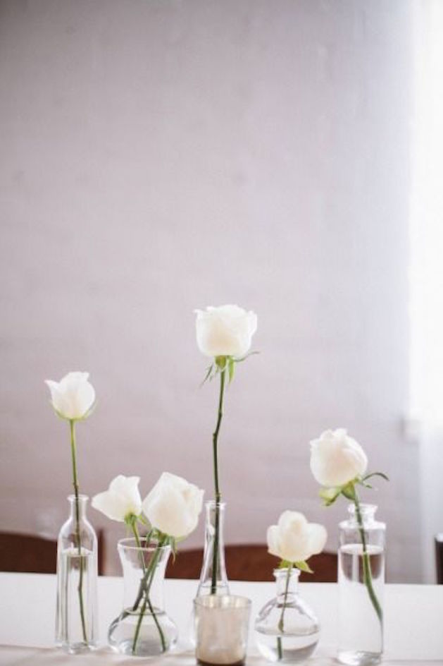 glass vases with white roses