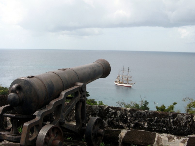 cannon aiming at pirate ship on the sea