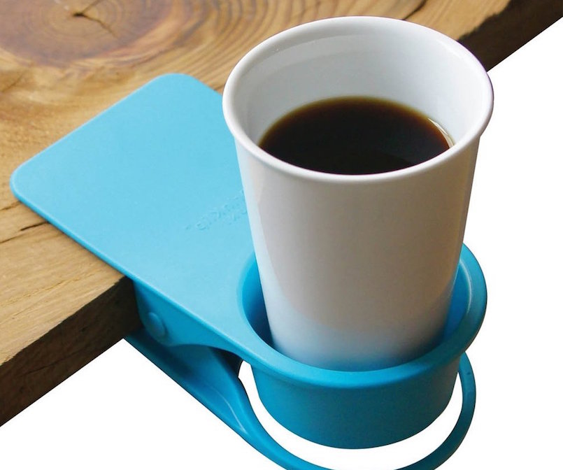 blue coaster cup holder clipped to wooden table