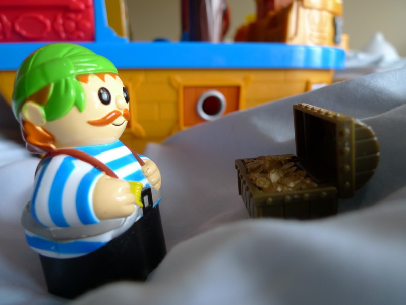 lego pirate looking at booty treasure