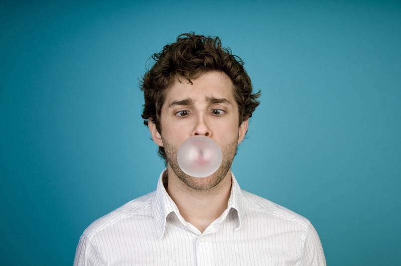 Man blowing bubble with gum