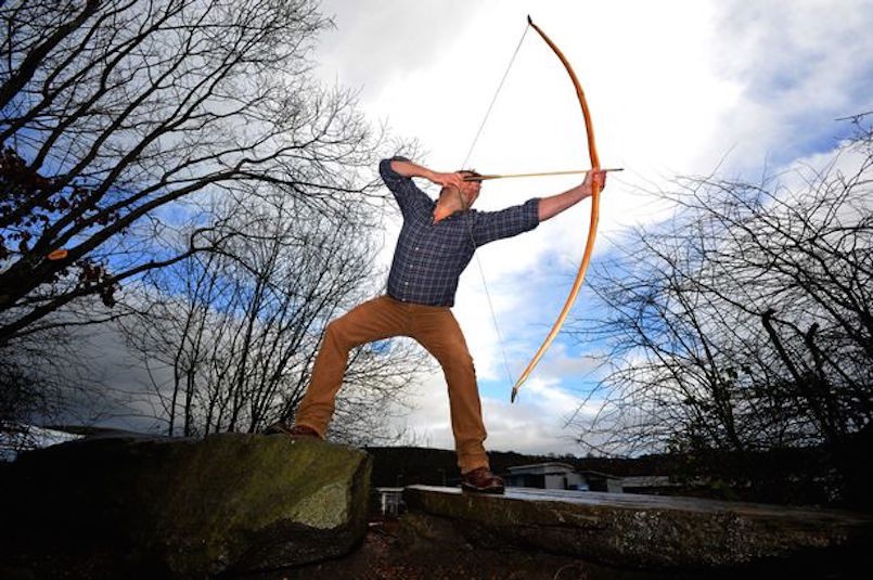 man with bow and arrow