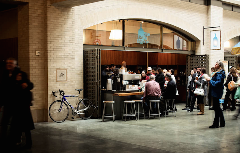 people standing in front of a coffee shop