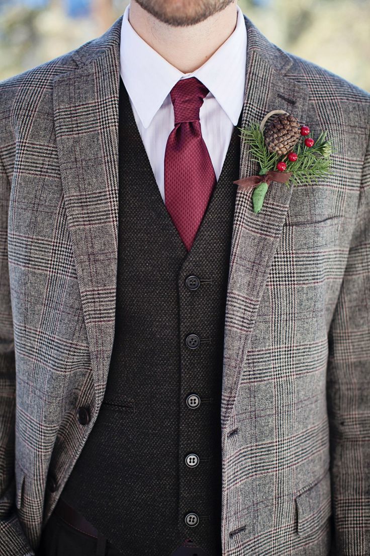 man in tweed jacket with holly and pinecone boutonniere wedding attire