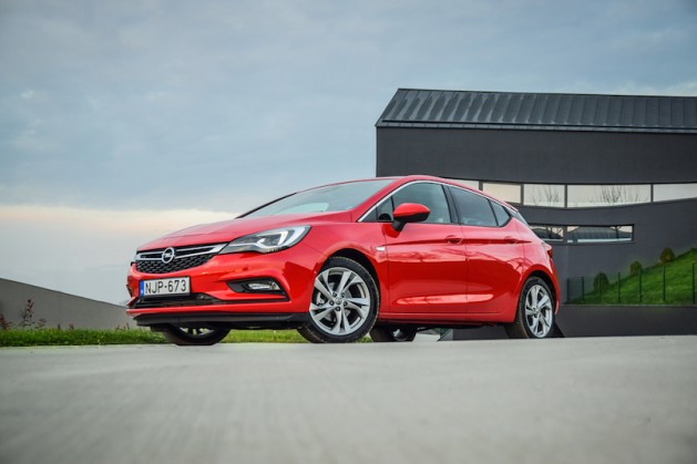2016 model year Opel Astra (generation K) at the test-drive. Red hatchback Opel Astra is equipped with headlights that consist of 16 individual matrix LED