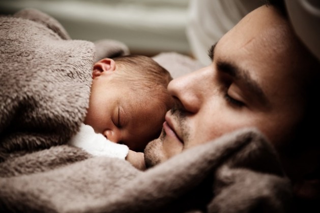 attractive man dad holding infant baby