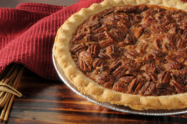 Close Up shot of a Pecan Pie Cooling on a Chopping Block