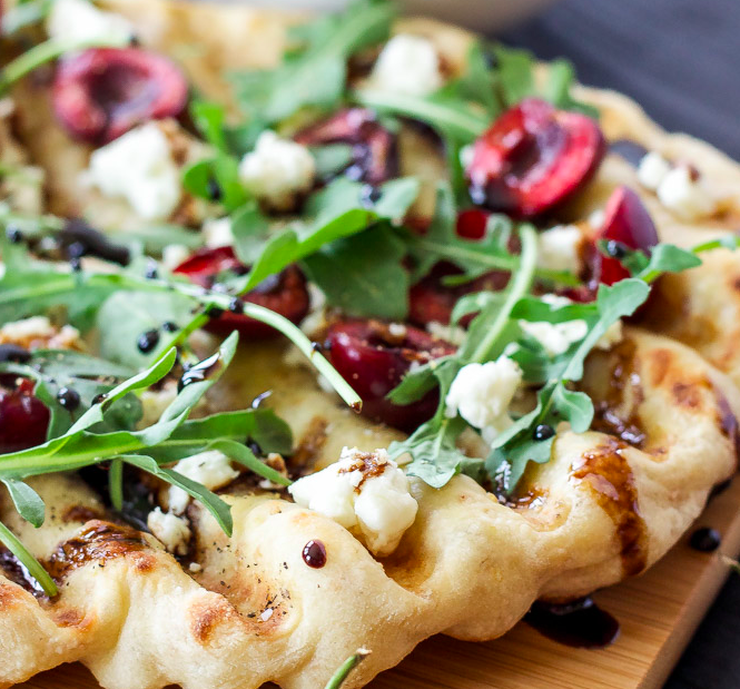 GRILLED CHERRY, GOAT CHEESE, AND ARUGULA PIZZA