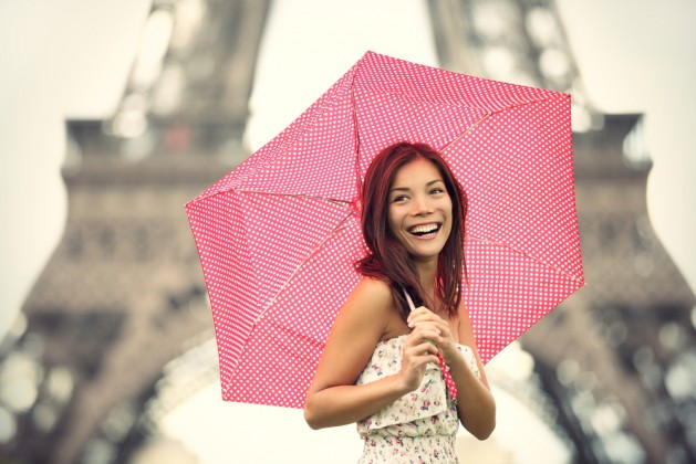 Paris Eiffel Tower Woman happy smiling in front of tourist attraction Eiffel Tower. Joyful fresh Caucasian Asian girl laughing