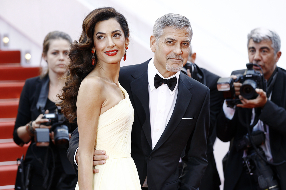 Actor George Clooney and his wife Amal Alamuddin Clooney attend the 'Money Monster' premiere during the 69th Cannes Film Festival