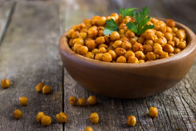 Roasted spicy chickpeas on rustic background