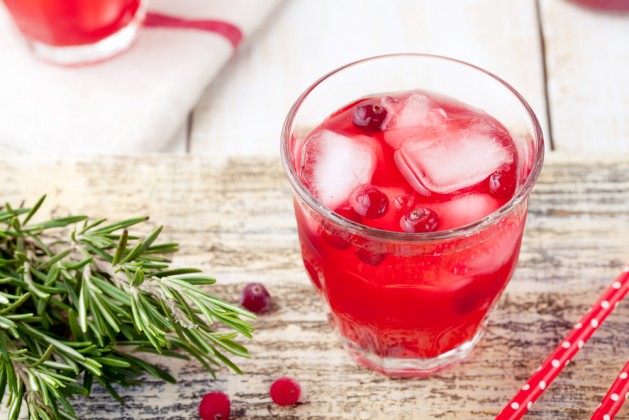 Cranberry and rosemary lemonade, cocktail, fizz on a white wooden background