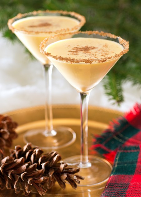 Two delicious eggnog martinis with brown sugar rimmer and cinnamon sprinkle