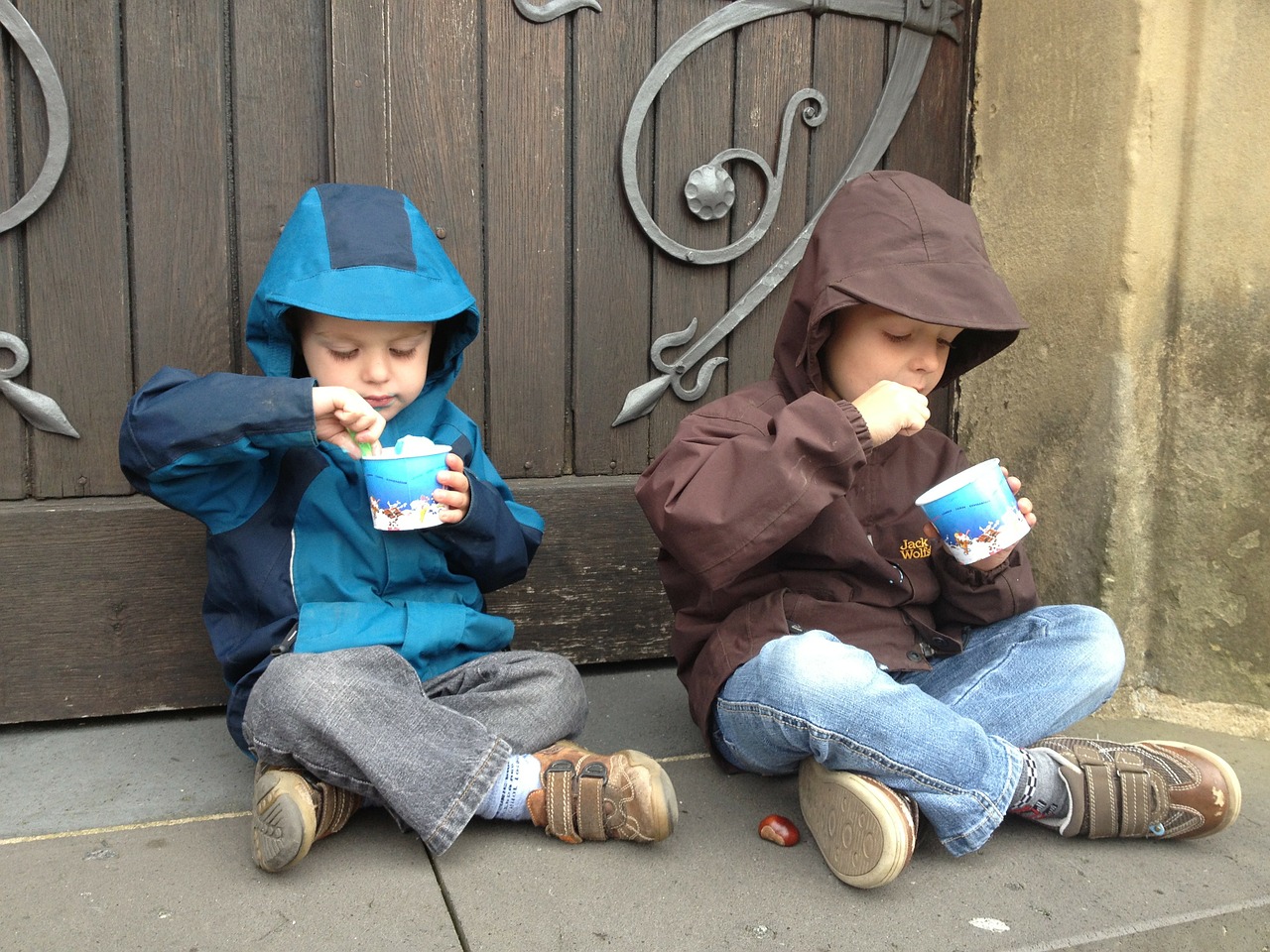 Two children eating ice cream