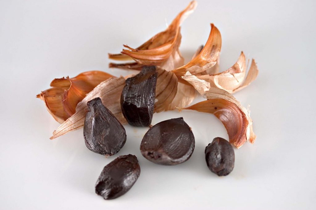 peeled black garlic cloves used to make black garlic aioli